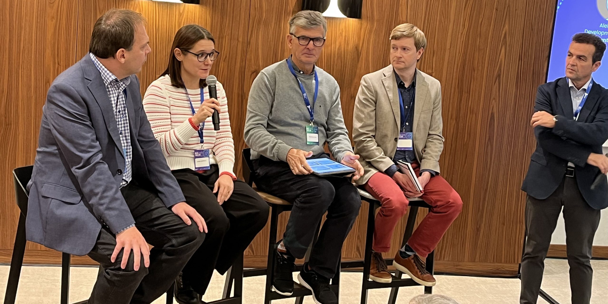 Four panelists and moderator at AI-themed panel discussion at EBDVF 2024