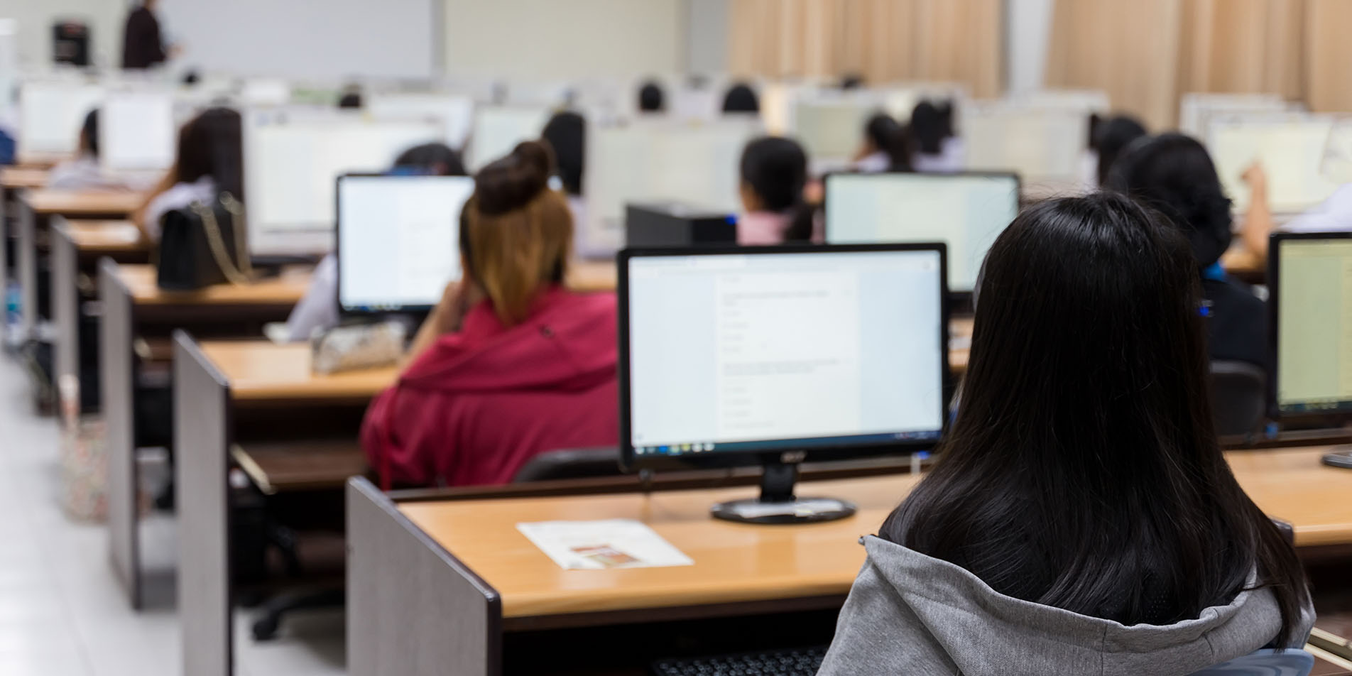 University student using computer studying in a computer room