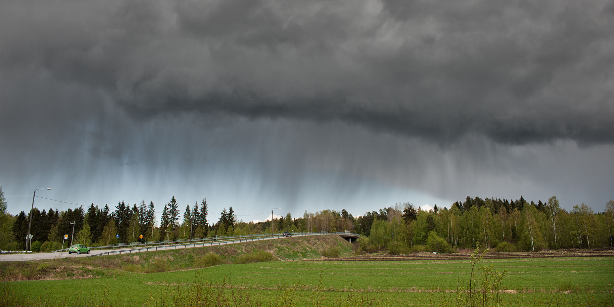 Stormy rain clouds over rural landscape